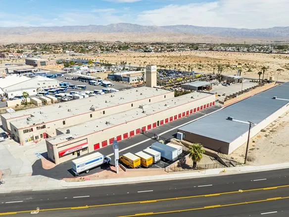 Aerial view of facility with drive up units and moving trucks