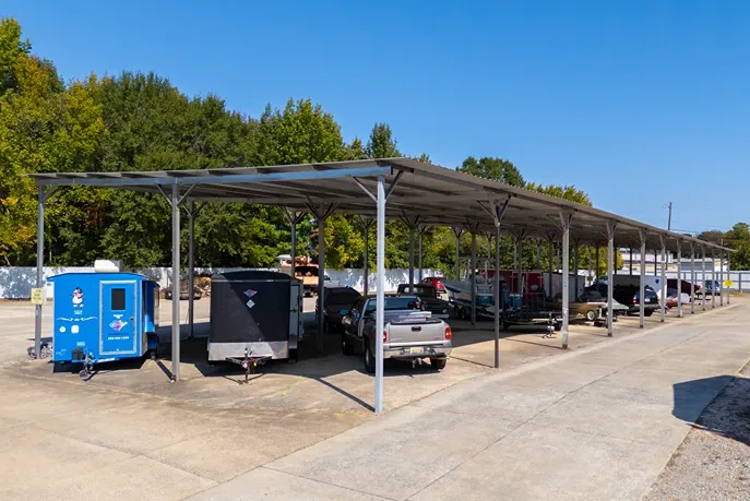 Covered RV and boat storage parking with canopy protection at self storage facility