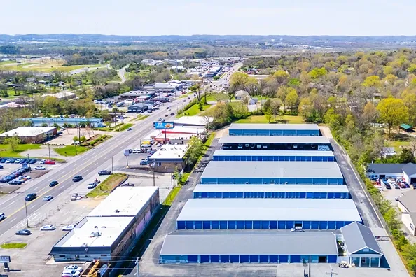 Aerial view of self storage facility near main road with surrounding residential and commercial areas