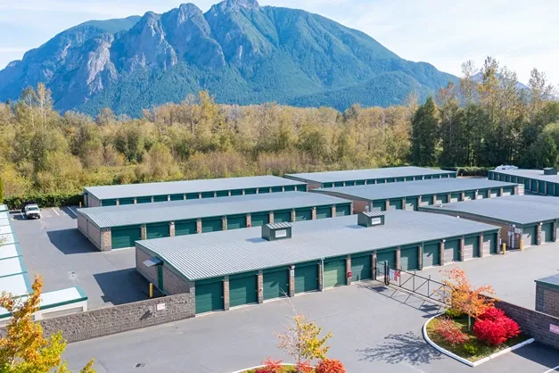 Aerial view of Devon Self Storage facility with drive-up units and mountain landscape backdrop