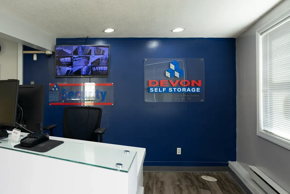 Office area with security tv wall at Devon Self Storage - Lambeth Park in Fairhaven, MA.