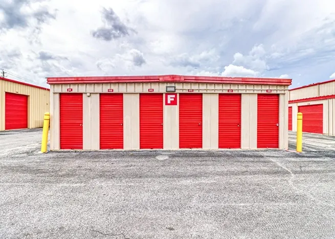 Drive-up storage units with roll-up doors and easy vehicle access