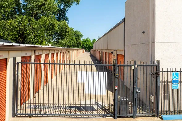 Gated self storage facility with secure entry and drive-up storage units