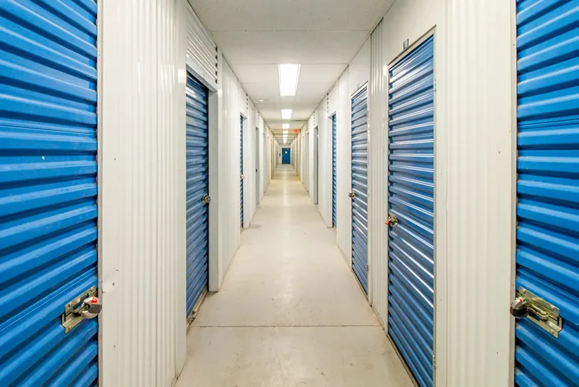 Indoor units down a hallway with roll up doors. 