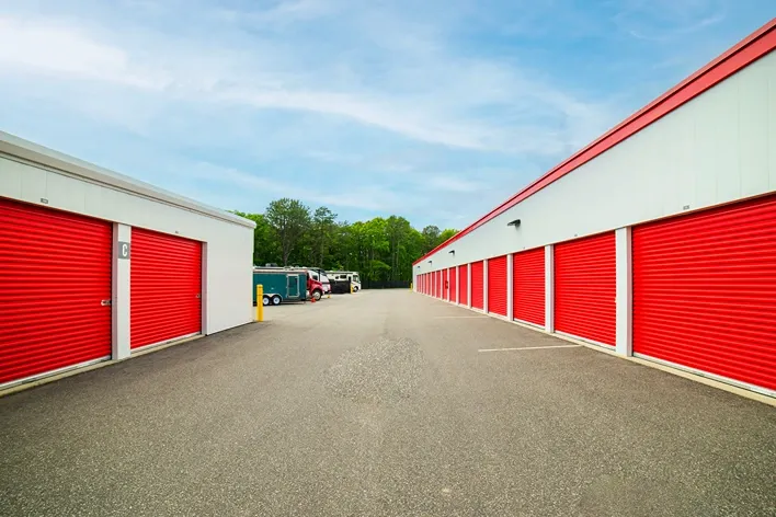 Devon Self Storage- Yaphank drive up storage, outdoor. large unit sizes with red doors. RV parking