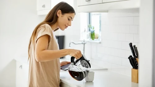 Woman pouring coffee.
