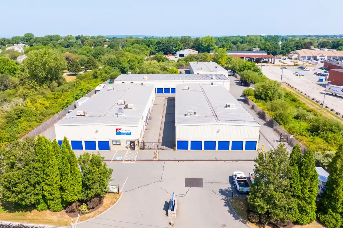 Aerial view of Devon Self Storage facility layout with multiple buildings, gated access, and parking area