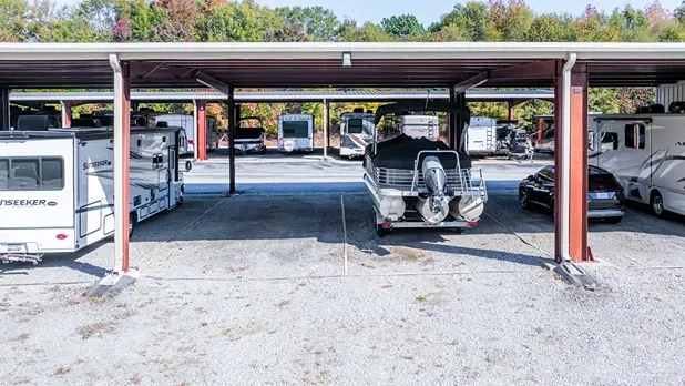 Covered RV and boat storage parking with individual spaces at self storage facility