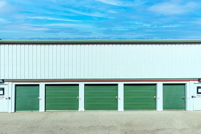 Devon - Exterior Units, green storage door, drive up access Devon Self Storage - Lemay Ferry