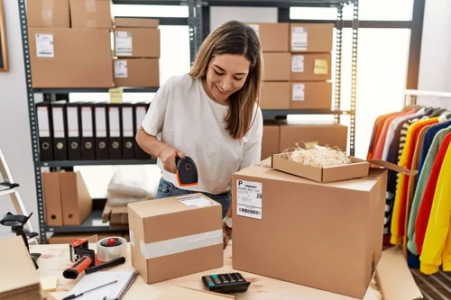 Young woman working on her business inventory.
