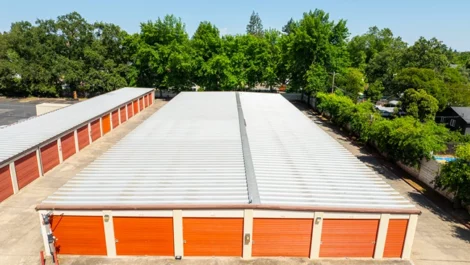 Outdoor, drone view of self storage units. Medium size, orange doors in Orangevale, CA, Drive up access at Devon Self Storage - Hazel