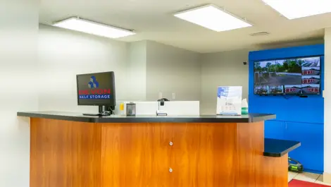 Office area with security camera, tv at Storage Units in South Cordova, TN, Devon Self Storage