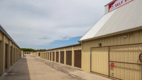 Rows of storage units, with brown doors Self Storage Units in New Braunfels