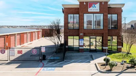 Exterior view of entrance and gated self storage at Devon Self Storage - Fort Worth on Blue Mound