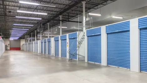 Indoor storage with blue doors at Devon Self Storage Units in Raleigh, Memphis, TN