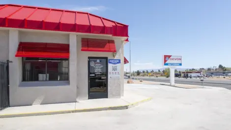 Entrance to storage facility in West Apple Valley, CA, at Devon Self Storage - West Apple Valley