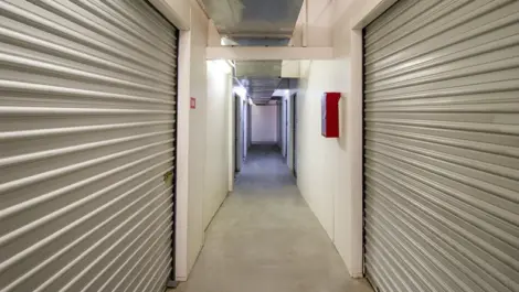 Hallway view of storage units in West Apple Valley, CA, at Devon Self Storage - West Apple Valley
