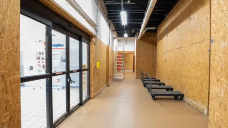 Entrance to Devon Self Storage in Pompano Beach, FL with dollies and ladder.