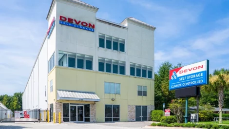 Exterior view with entrance and sign of climate controlled storage at Devon Self Storage in Highlands, Jacksonville, FL