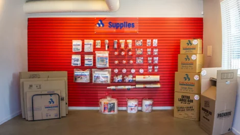 Wall of storage supplies and boxes for packing and moving available at Devon Self Storage - Marconi in Sacramento, California