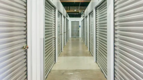 Hallway of storage units, small units with silver color doors , at Devon Self Storage - Marconi in Sacramento, California