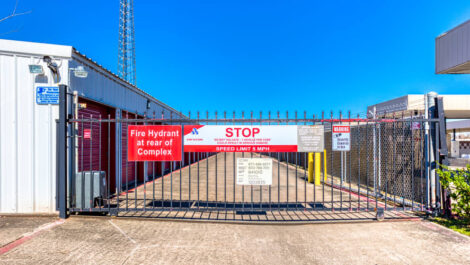 Gated entry leading into Devon Self Storage in Pasadena, Texas