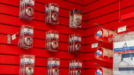 Wall of storage supplies like locks, tape, furniture covers at Devon Self Storage - St. Augustine