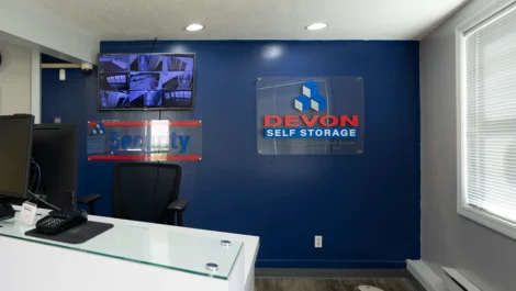 Office area with security tv wall at Devon Self Storage - Lambeth Park in Fairhaven, MA.