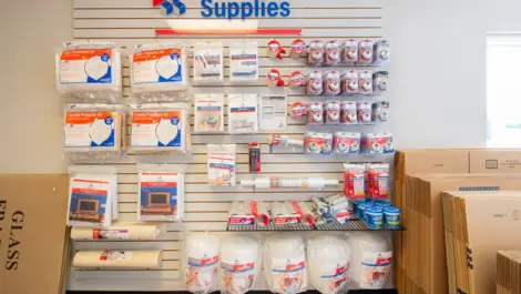 Wall of storage supplies in Bixby, OK, at Devon Self Storage Bixby