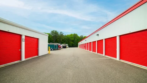 Devon Self Storage- Yaphank drive up storage, outdoor. large unit sizes with red doors. RV parking