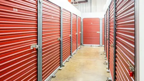 Red doors to self storage units, indoor storage at Devon Self Storage - 2207 Pinhook RD