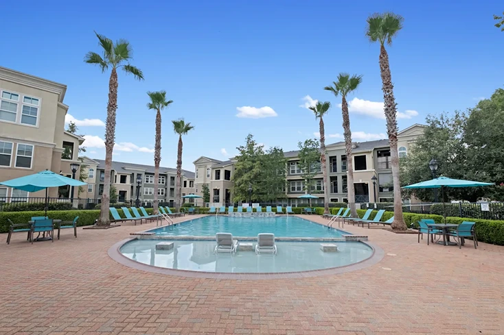 Poolside at Millennium Towne Center apartments near Devon Self Storage Coursey Blvd
