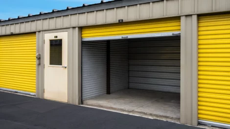 Outdoor, drive up storage units, large unit open with yellow door. Devon Self Storage - Stage Coach Trail in Greensboro, NC