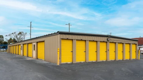 Outdoor storage units with yellow doors at Devon Self Storage - Stage Coach Trail in Greensboro, NC