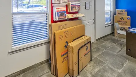 Office area at Devon Self Storage - Vance Jackson in San Antonio, TX with boxes for moving, packing & storage supplies.