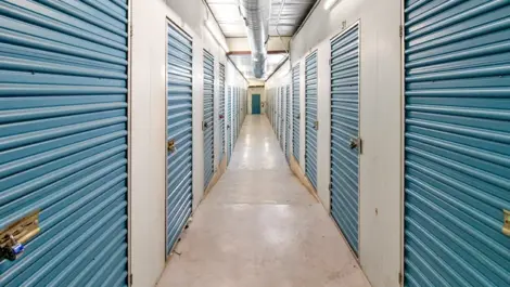 Indoor view of storage units. Blue doors at Devon Self Storage - Vance Jackson in San Antonio, TX