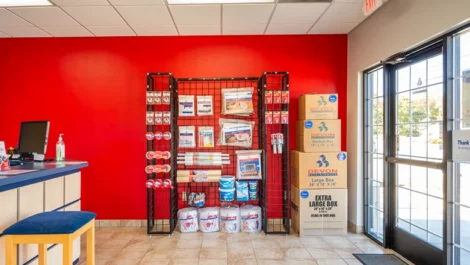 Wall of self storage supplies. Moving, packing and storage boxes in office area in Greensboro, NC, at Devon Self Storage - Hilltop Road
