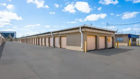 Light yellow doors, drive up storage at Devon Self Storage - 2310 Pinhook RD