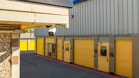 Yellow doors on drive up storage units in in Dallas, TX, at Devon Self Storage - Plantation Road