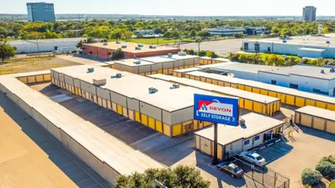 Closer sky view of Devon Self Storage - Plantation Road. Signage, yellow doors, drive up storage units in