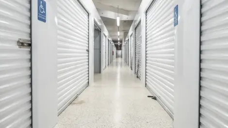 Wheelchair accessible signs on walls at interior view of storage units at Devon Self Storage - Lawrenceville in Lawrenceville, GA
