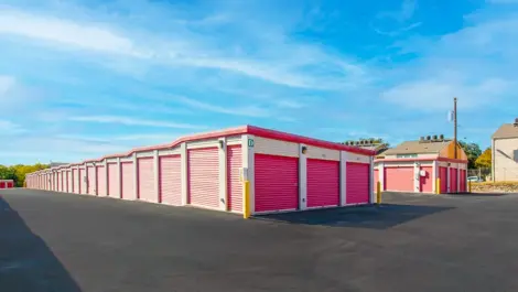 exterior view of outdoor storage units with red doors. Drive up access, wide lanes for drop off Devon Self Storage - Ingram Road in San Antonio, TX