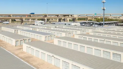 Drive up storage units. Wide lanes for drive up access. Exterior view of storage units at Devon Self Storage - Loop 410 in San Antonio, TX