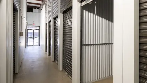 Devon Self Storage - Peachtree Corners, open storage unit, medium size. Grey door and white walls. Views of entrance to indoor storage.