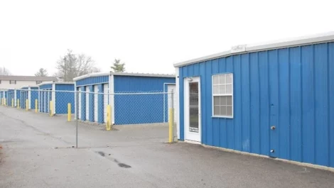 Devon Self Storage - Fort Campbell, blue building, white doors, gated, secure storage area