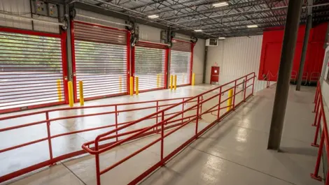 Indoor loading and unloading in Michigan Self Storage facility with drive-up access units