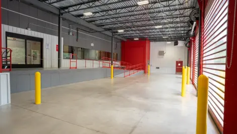 Indoor loading and unloading in Michigan Self Storage facility with drive-up access units