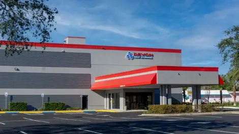 Devon Self Storage in Holly Hill, FL, front entrance. Covered drop off and nicely paved parking lot