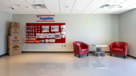 Front office area with chairs and packing supplies